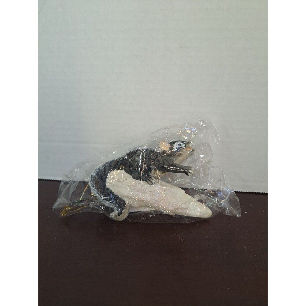 Charming Tails Skunk On Snowflake Sled Ornament